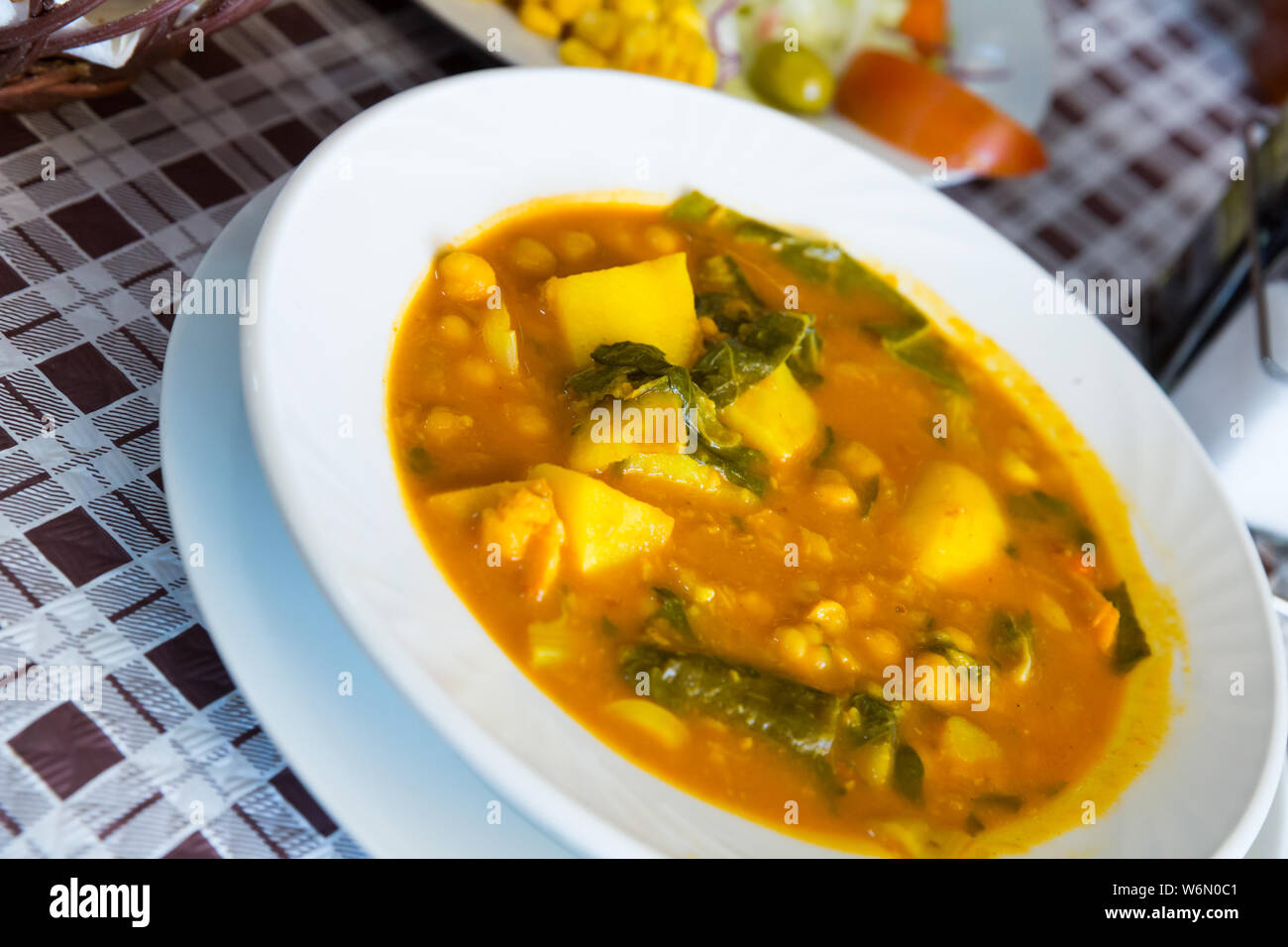 Savory garbanzo soup with spinach. Popular Spanish recipe Stock Photo