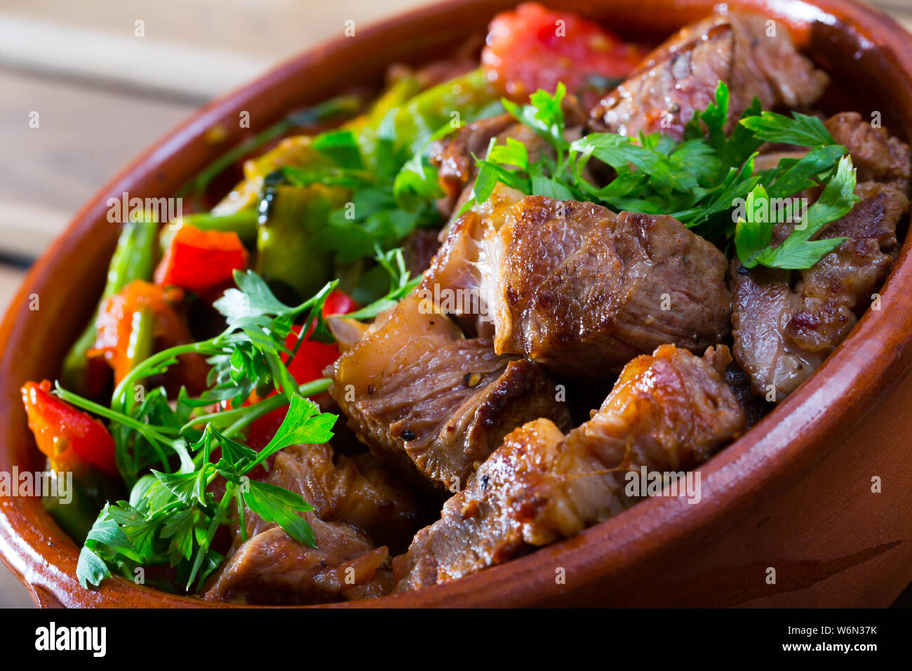 Clay pot with juicy pieces of stew meat mixed with vegetables Stock ...