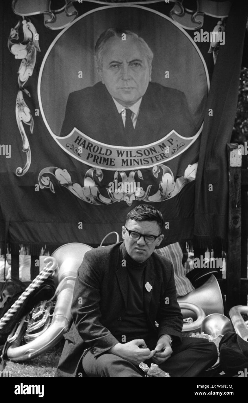 Harold Wilson a portrait of the PM Prime Minister on a Horden Lodge miner's colliery pit  banner at the annual County Durham Miners Gala. A miner sits under a banner England UK 1970s 1974 HOMER SYKES Stock Photo