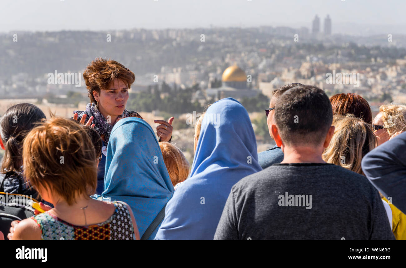 Tourist guide with a group in Jerusalem Stock Photo