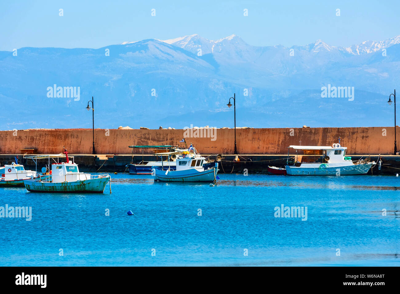 Fishing boats and mountain view in Messinia, Peloponnese, Greece Stock Photo