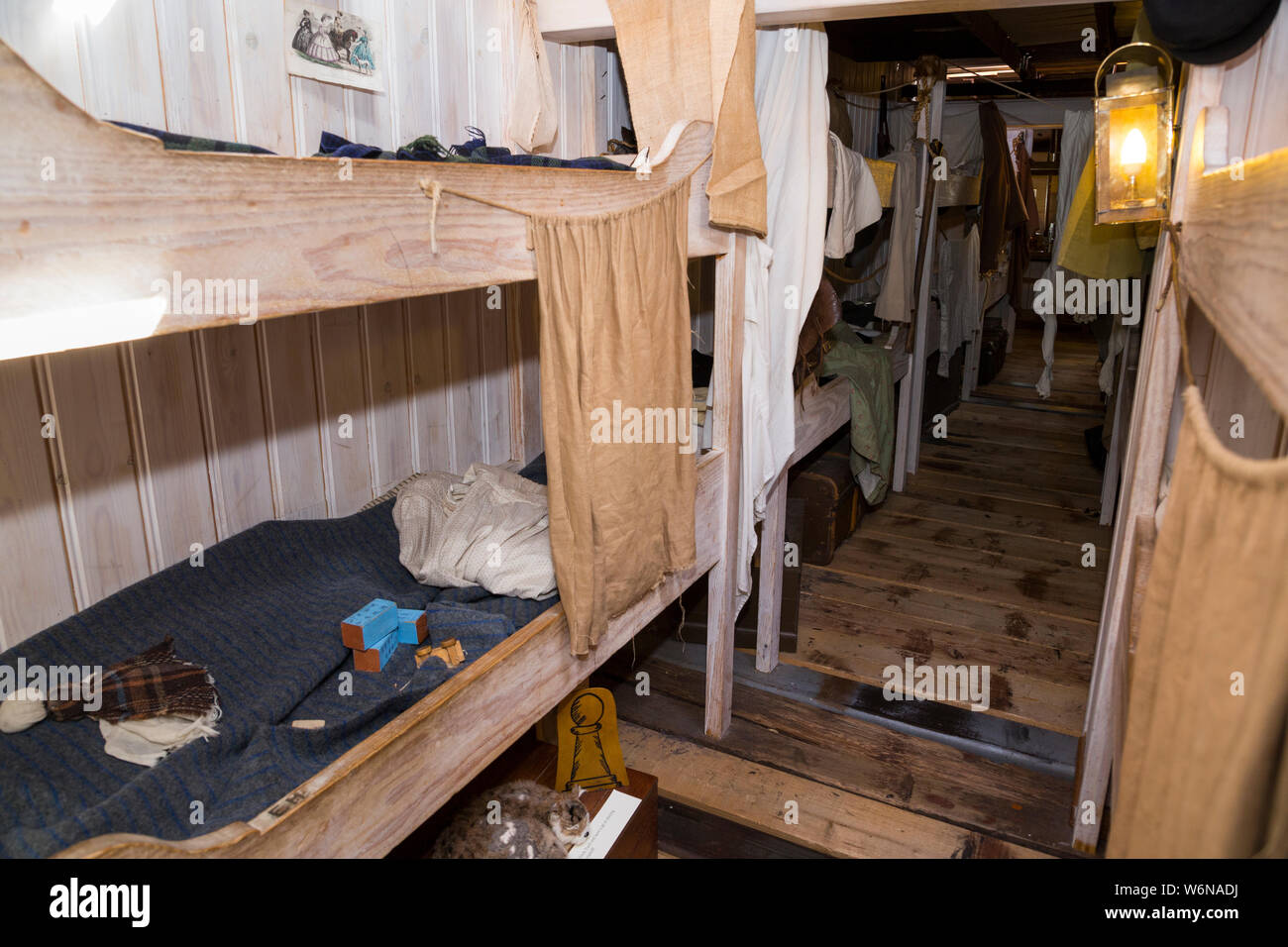 Cabin room / cabin rooms / bedroom / bed room with bunk beds berth for  passengers on board the SS Great Britain. Brunel's ship is now a museum museum attraction and hosts children on sleepovers etc so the bed is larger than the original steerage class. Bristol, UK (109) Stock Photo