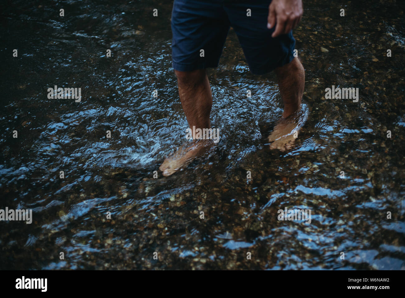 Wading through a river hires stock photography and images Alamy
