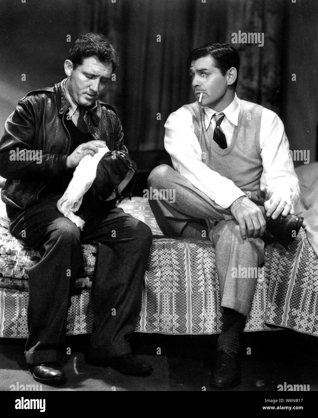 CLARK GABLE and SPENCER TRACY in BOOM TOWN (1940), directed by JACK CONWAY. Credit: M.G.M / Album Stock Photo