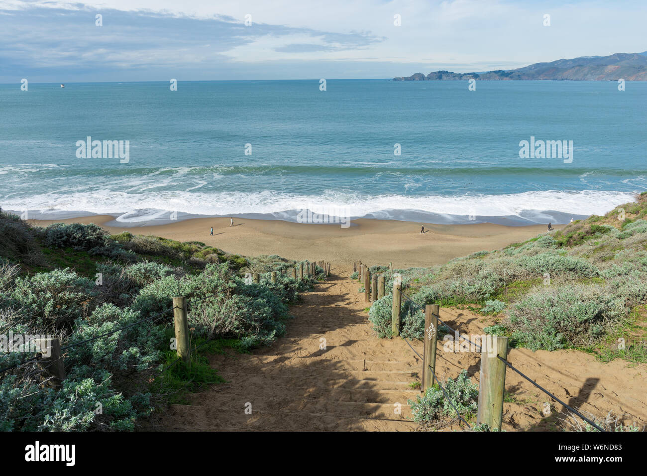 Stairway to ocean beach in Sanfrancisco made on sandy hill with thick wooden logs. Stock Photo