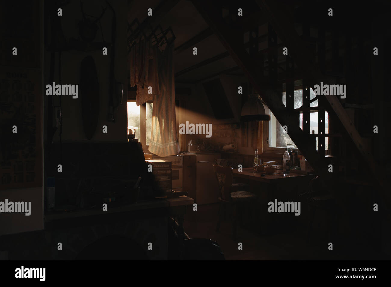 beautiful evening light shining through window of a cottage Stock Photo