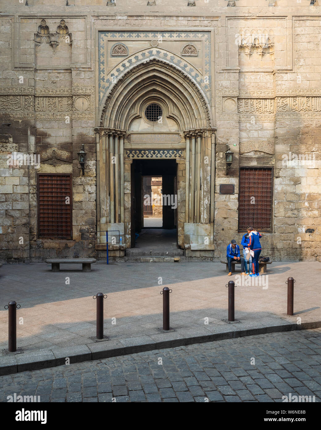 Cairo, Egypt- December 12 2015: Entrance of theological school and Mausoleum of Sultan Qalawun, Moez Street Stock Photo