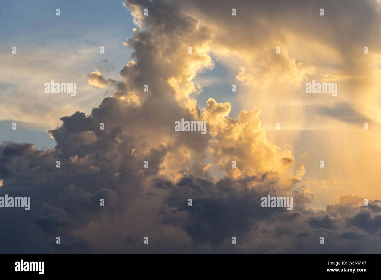 Evening sky with dramatic clouds over the sea with sculpted 3D ...