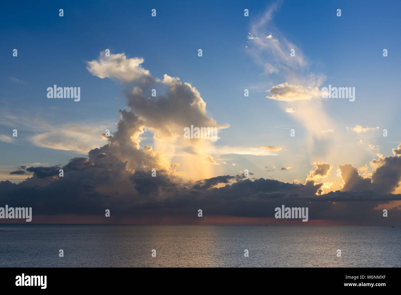 Evening sky with dramatic clouds over the sea with sculpted 3D ...