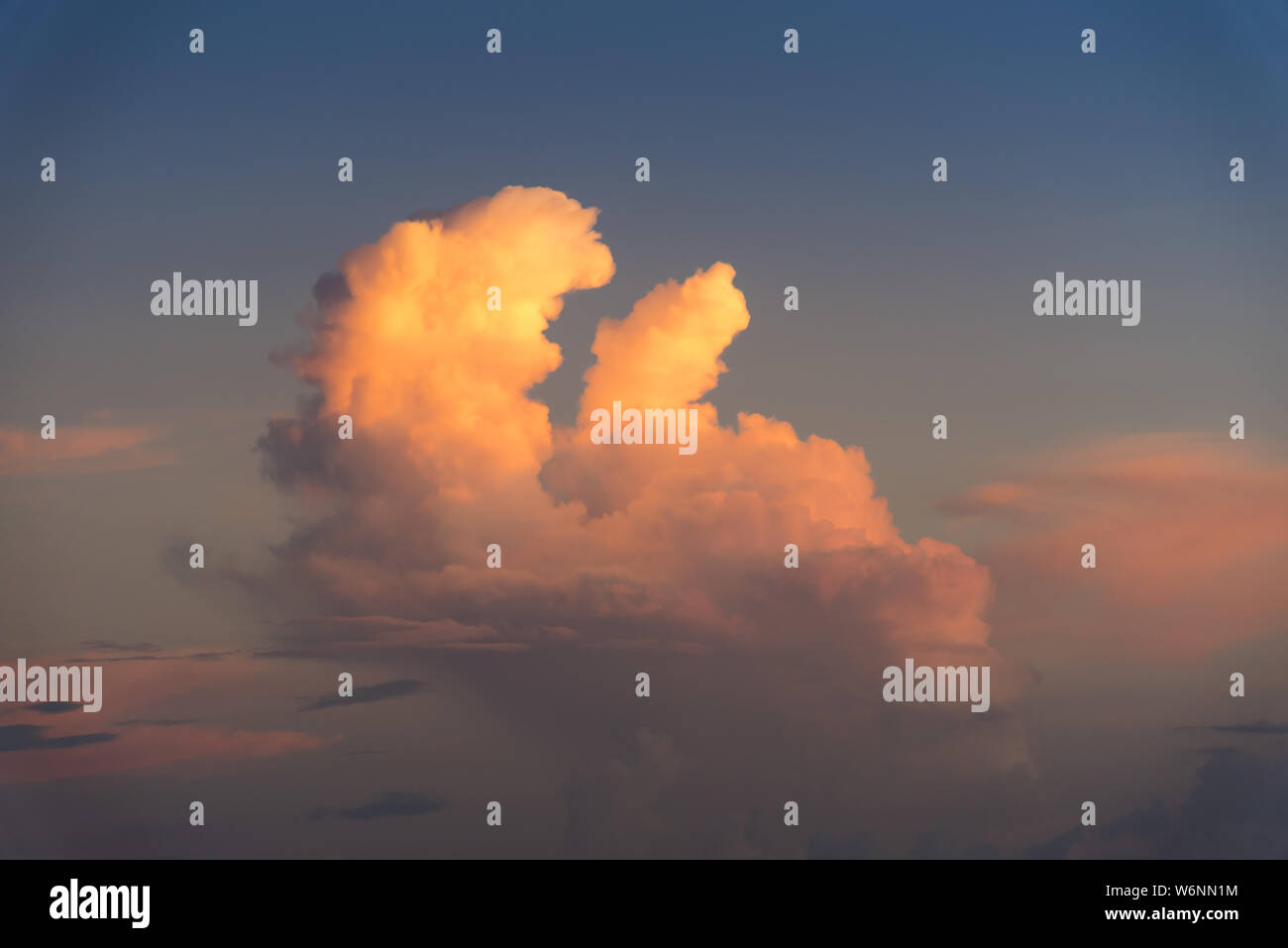 Evening sky with dramatic clouds over the sea with sculpted 3D ...