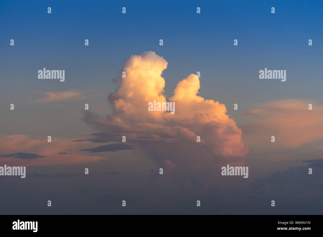 Evening sky with dramatic clouds over the sea with sculpted 3D ...