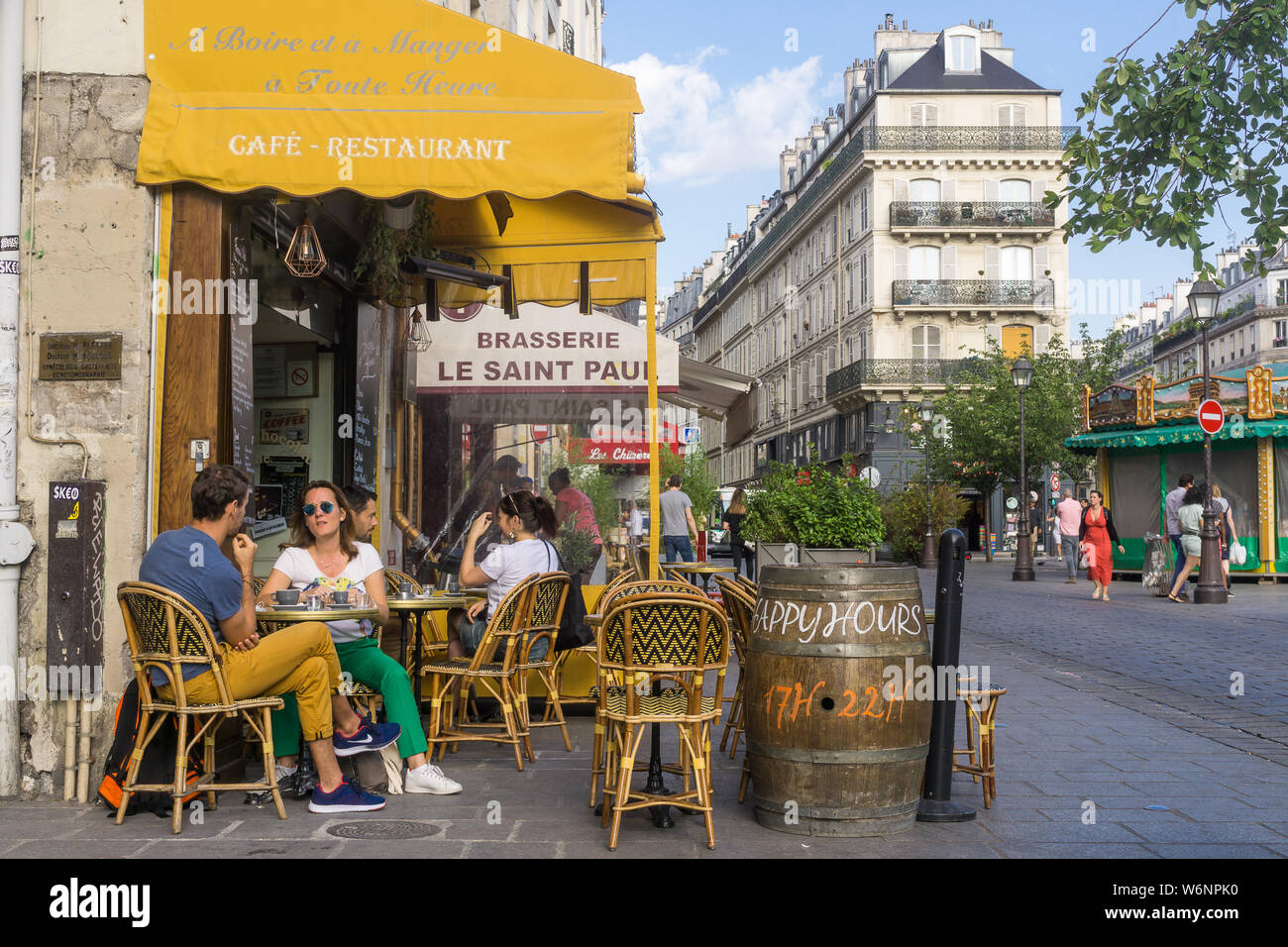 Paris cafe Marais - patrons sitting at Elephant Du Nil cafe in Marais district of Paris, France, Europe. Stock Photo