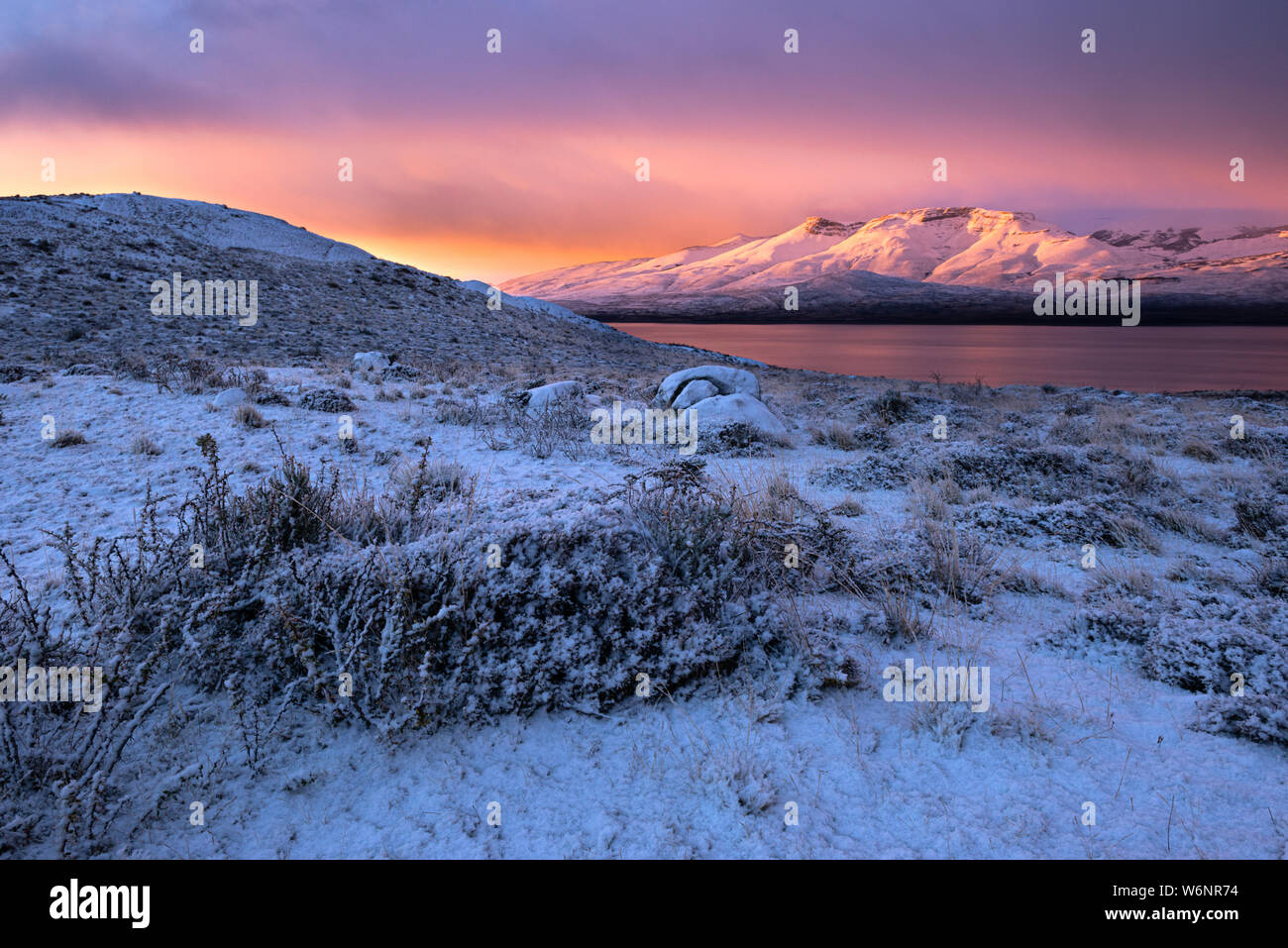 Pink sunrise in Torres del Paine National Park, Chile, during the winter. Stock Photo