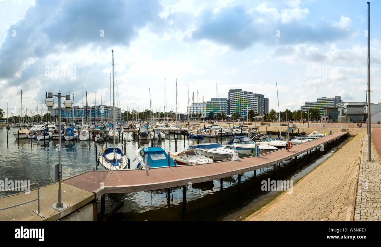 Panorama of the marina at  Damp at the Baltic Sea coast with apartment buildings and health clinic in background Stock Photo