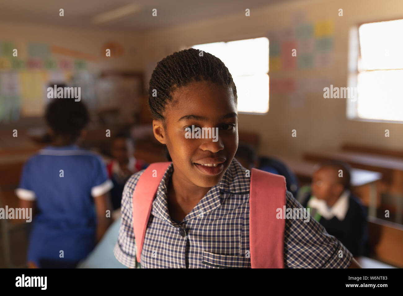 Portrait of a young schoolgirl smiling Stock Photo - Alamy