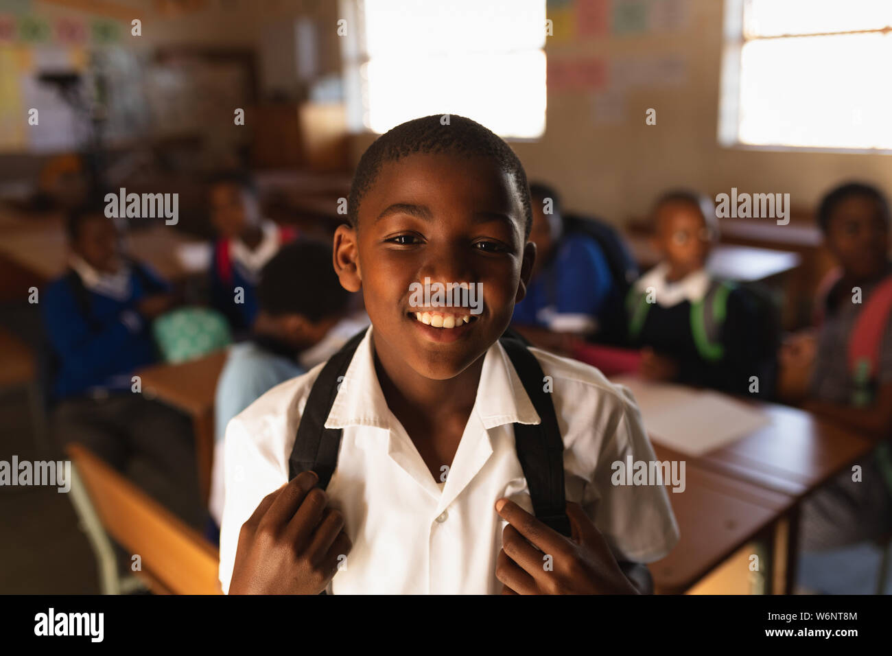 Portrait of a young schoolboy smiling Stock Photo - Alamy