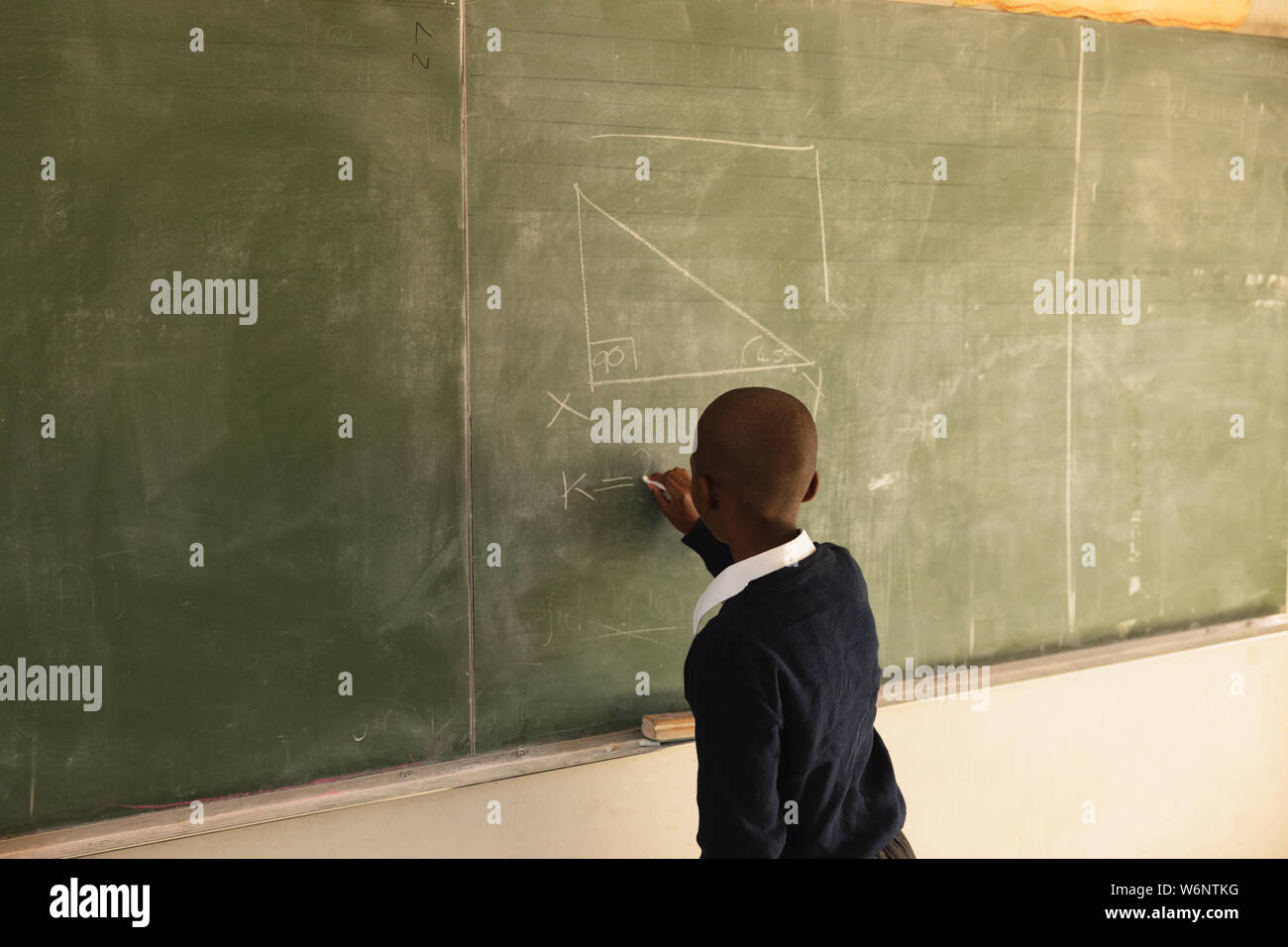 African american child writing hi-res stock photography and images - Alamy