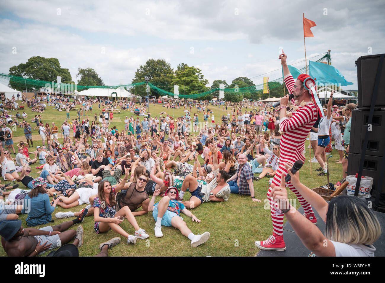 Cornbury Estate, Oxfordshire, UK. Friday 2nd August 2019. Wilderness Festival, Oxfordshire, UK.  Revellers enjoying the sun as Wilderness gets into full swing. Now in its 9th year, the festival is a celebration of art, music, fashion and culture on Cornbury Estate near Chipping Norton. Picture: Andrew Walmsley/Alamy Live News Stock Photo