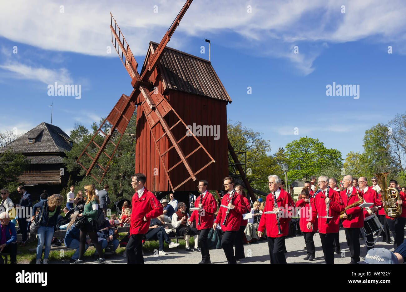 Nordic musician band passing by Skansen's Olandskvarnarna site spot, heading to the concert stage.Norway national independence day celebrations.Sweden Stock Photo