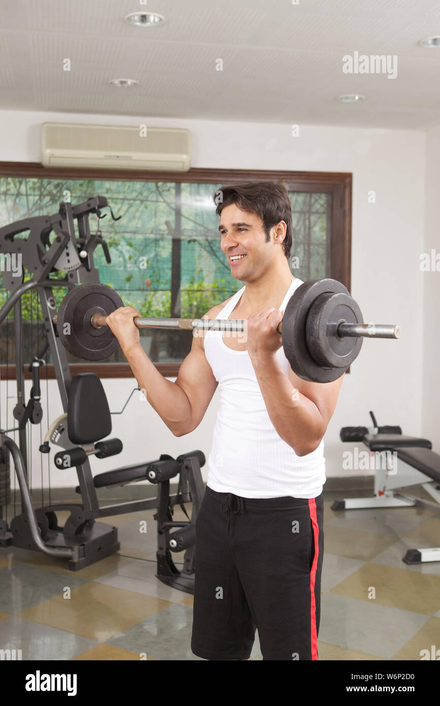 Man exercising in gym Stock Photo