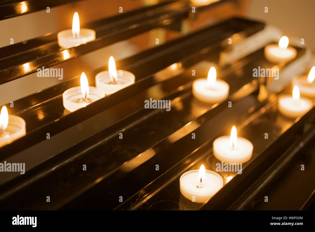 Candles lighting in Catholic Church Stock Photo Alamy