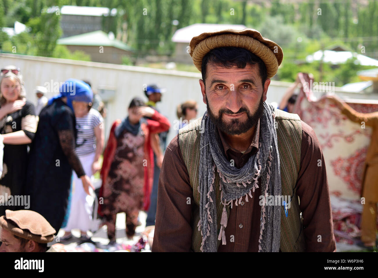 KHOROG, PAMIR MOUNTAINS, TAJIKISTAN - 06 JULY 2019: Portrait of the people of Afghanistan which is trading on the market in Tajikistan in the Pamir Mo Stock Photo