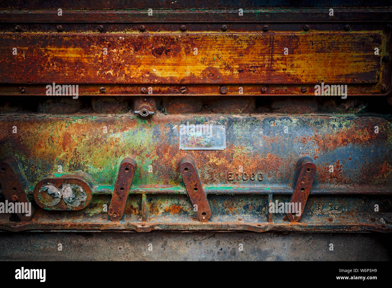 Worn metal surface from a large obsolete tractor engine. Stock Photo