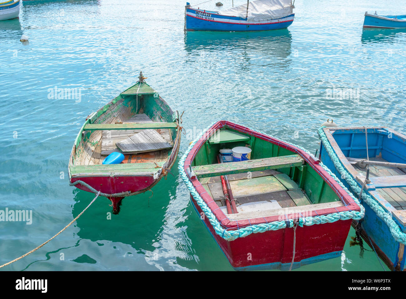 Maltese boats float in the harbor of Marsaxlokk, Malta. the fishing