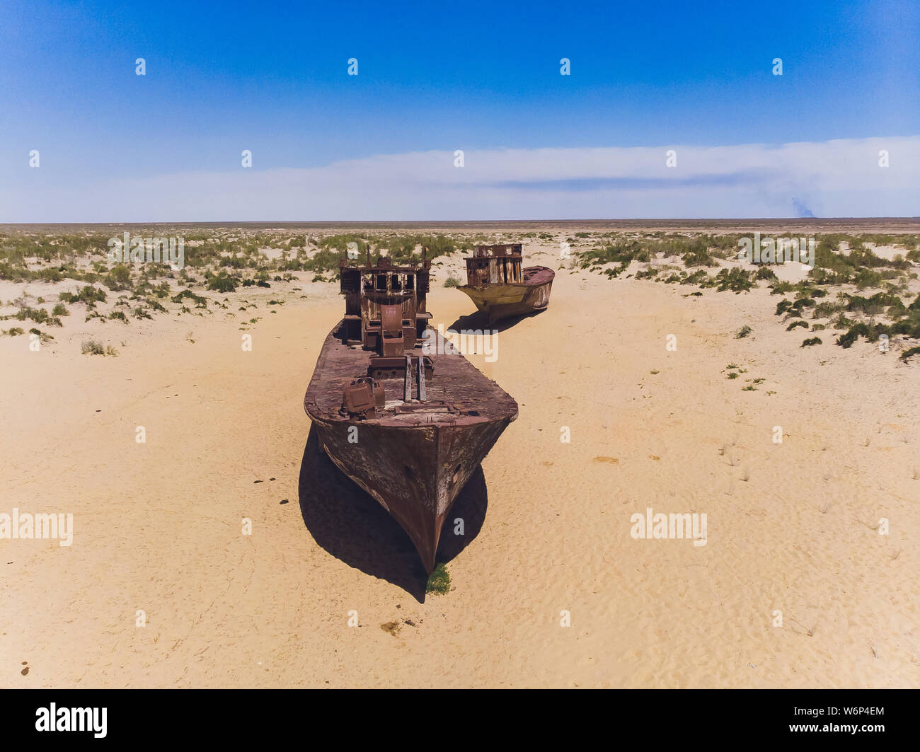 NUKUS, UZBEKISTAN - MAY 1, 2019: Real model of former sea boat on a pedestal as monument of passed days when Mo'ynoq was an active sea port on Aral Stock Photo