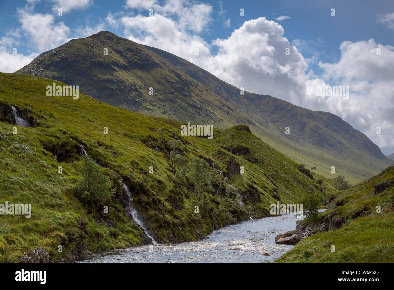 River flows past mountain at Glen Etive in the Scottish highlands Stock Photo