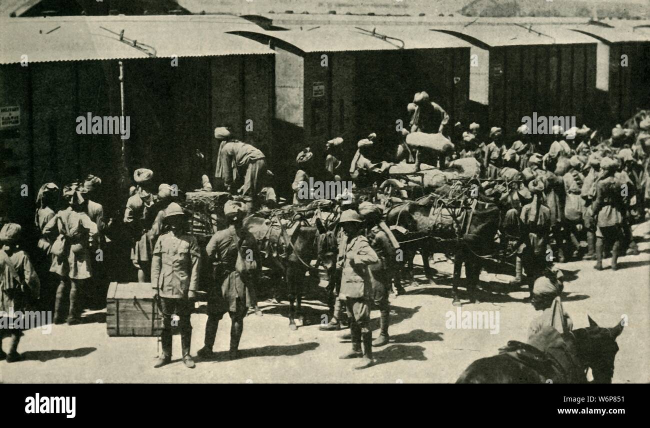 British and Indian soldiers at Bombay, India, First World War, 1914, (c1920). 'India's Army for the European War: Unloading Regimental Baggage before embarking at Alexandra Dock, Bombay', [Mumbai]. Over one million Indian troops in the British Indian Army (of the Raj) fought in the European, Mediterranean and the Middle East theatres of war. At least 74,187 Indian soldiers died, with 67,000 wounded. From &quot;The Great World War - A History&quot; Volume I, edited by Frank A Mumby. [The Gresham Publishing Company Ltd, London, c1920] Stock Photo