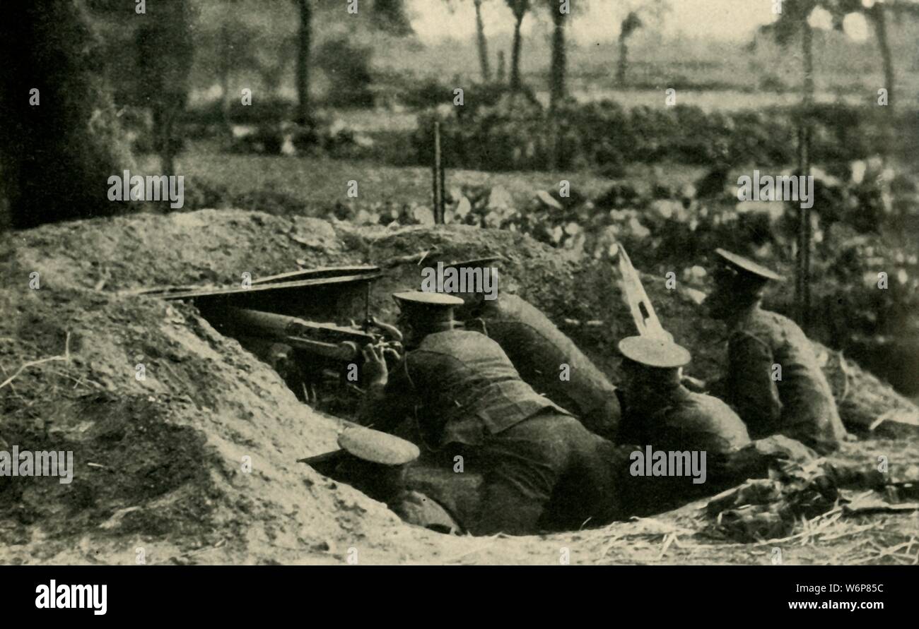 British Naval Division at Antwerp, Belgium, First World War, 1914, (c1920). 'With the British Naval Division at Antwerp: a maxim-gun squad in action during the last days of the German bombardment'. From &quot;The Great World War - A History&quot; Volume I, edited by Frank A Mumby. [The Gresham Publishing Company Ltd, London, c1920] Stock Photo