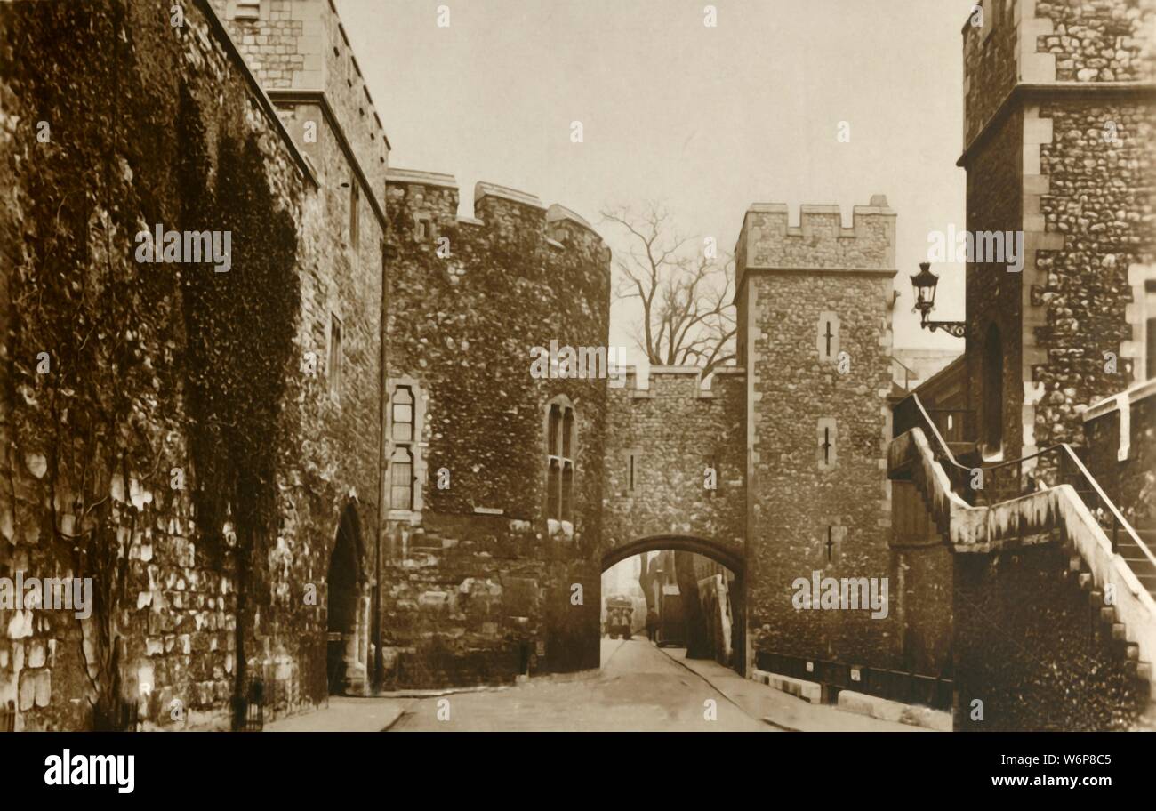 'Tower of London. On Left - Bloody Tower. On Right - St. Thomas's Tower and Wakefield Tower', c1910. View of part of the Tower of London - historic palace, prison, fortress and armoury - which dates from the 11th century. 'The Wakefield Tower, in which, since 1856, the Crown Jewels have been kept. The Bloody Tower, aptly named, for here the young Princes were murdered by order of their Uncle Richard III. St. Thomas's Tower, above the Traitors' Gate, through which many illustrious prisoners have passed, little deserving the name of traitor.' Postcard. [Raphael Tuck &amp; Sons] Stock Photo