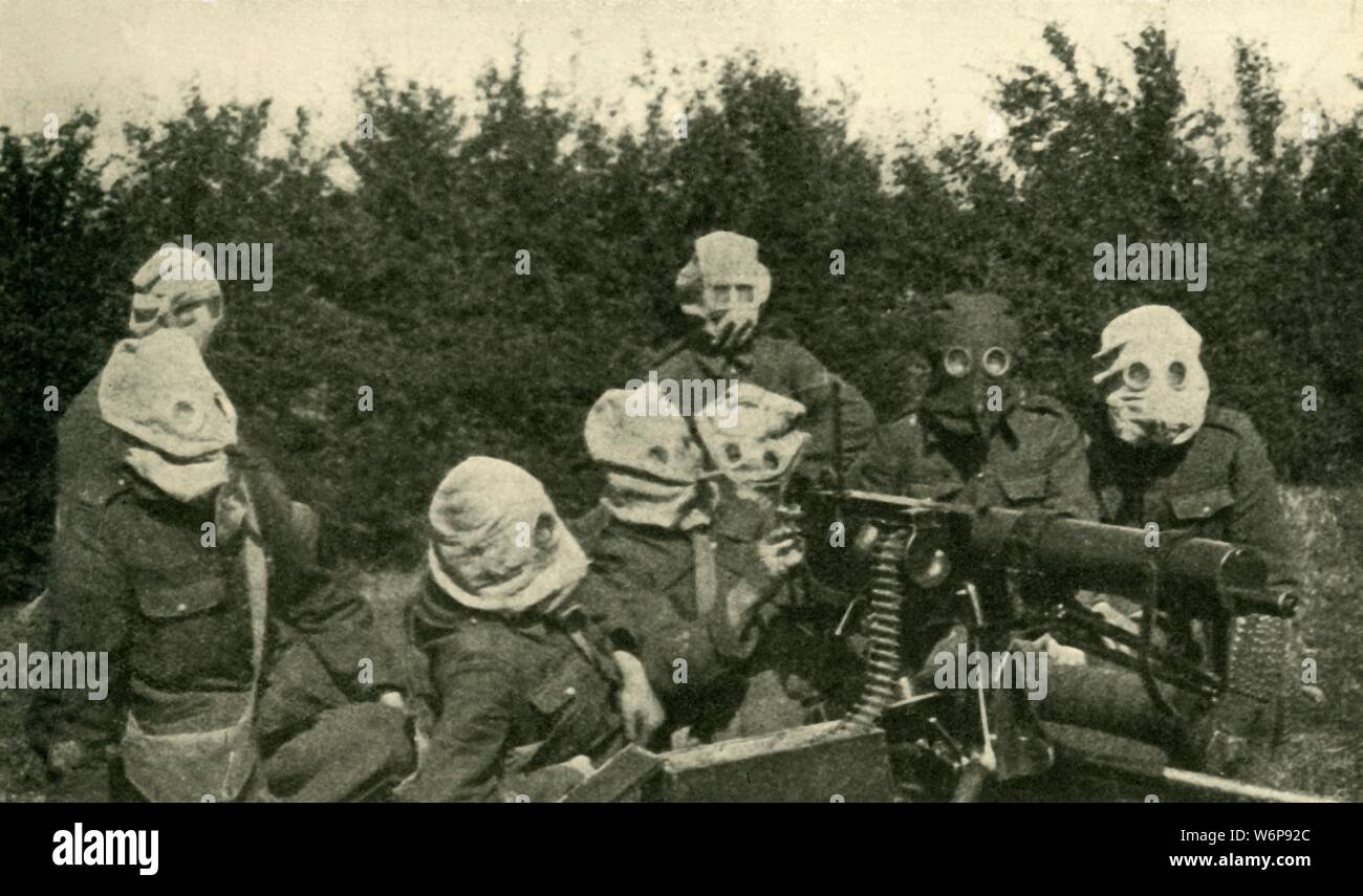 'Modern Warfare on the Western Front: British Machine-gun Section wearing anti-gas masks', First World War, 1914-1918, (c1920). From &quot;The Great World War - A History&quot; Volume IV, edited by Frank A Mumby. [The Gresham Publishing Company Ltd, London, c1920] Stock Photo