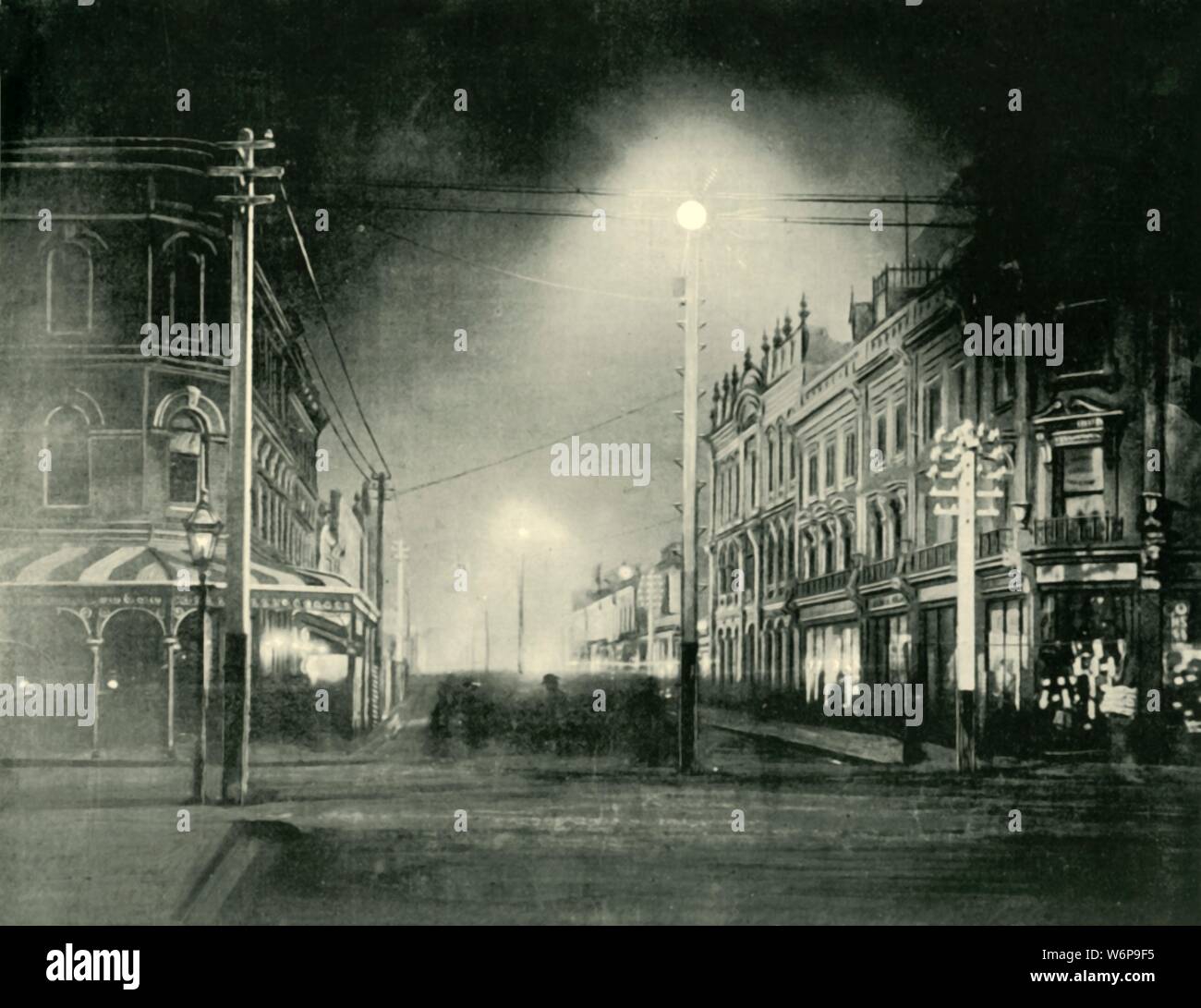 'Launceston By Night (Brisbane Street)', 1901. City in the north Tasmania, settled by Europeans in March 1806 and named after  Launceston, Cornwall. From &quot;Federated Australia&quot;. [The Werner Company, London, 1901] Stock Photo
