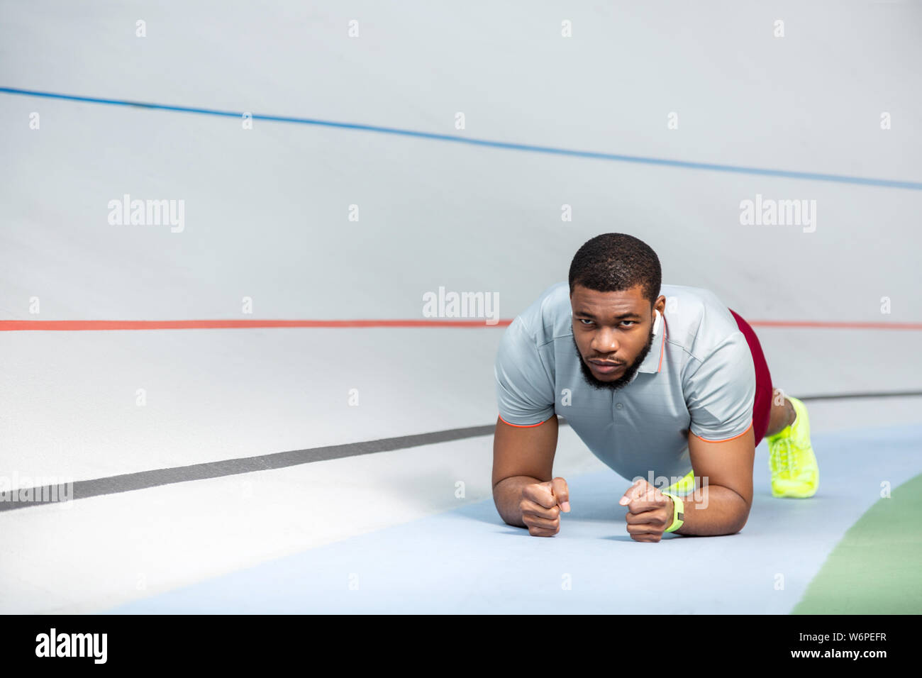Young African American sportsman doing a plank exercise Stock Photo