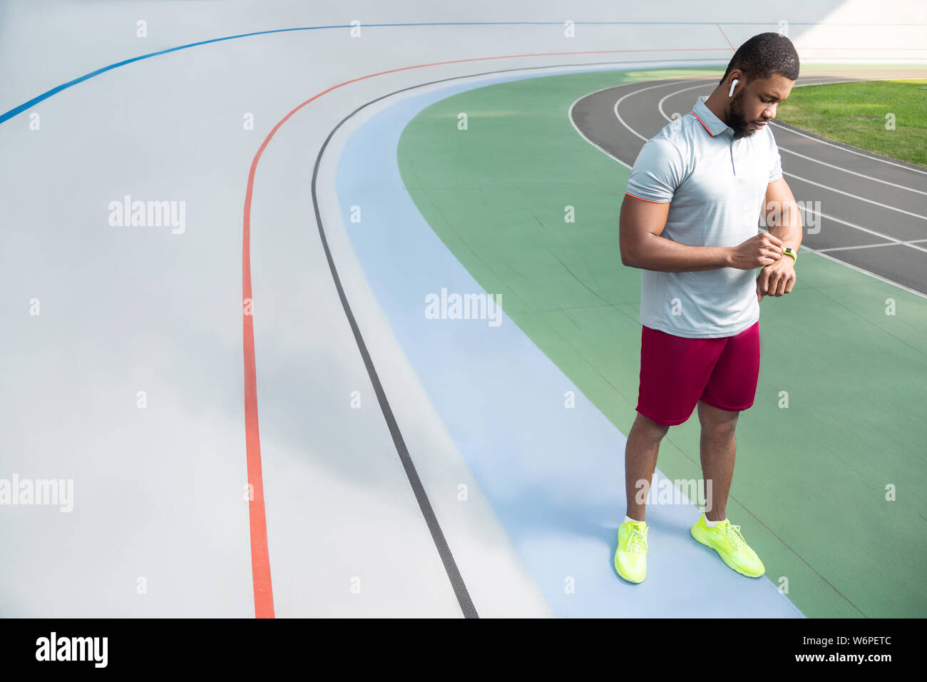 African American sportive man checking his fitness tracker Stock Photo