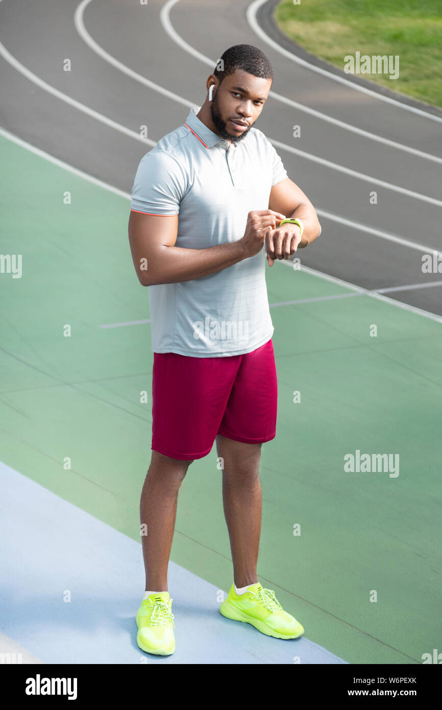 Man with a fitness tracker on the wrist Stock Photo