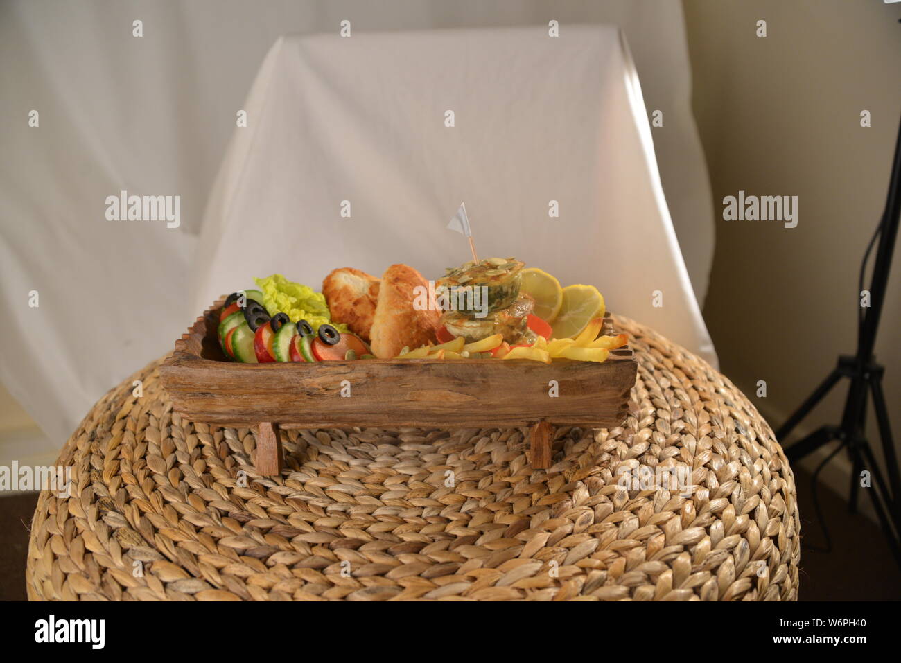 basket full of foods serving food with chips fries olives vegetarians vegan cucumber lime fast food and unhealthy foods junk foods bread beauty Stock Photo