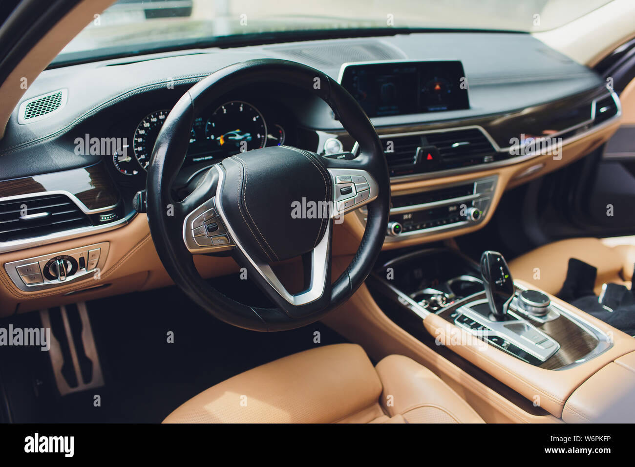 Luxury car interior. Steering wheel, shift lever and dashboard Stock ...