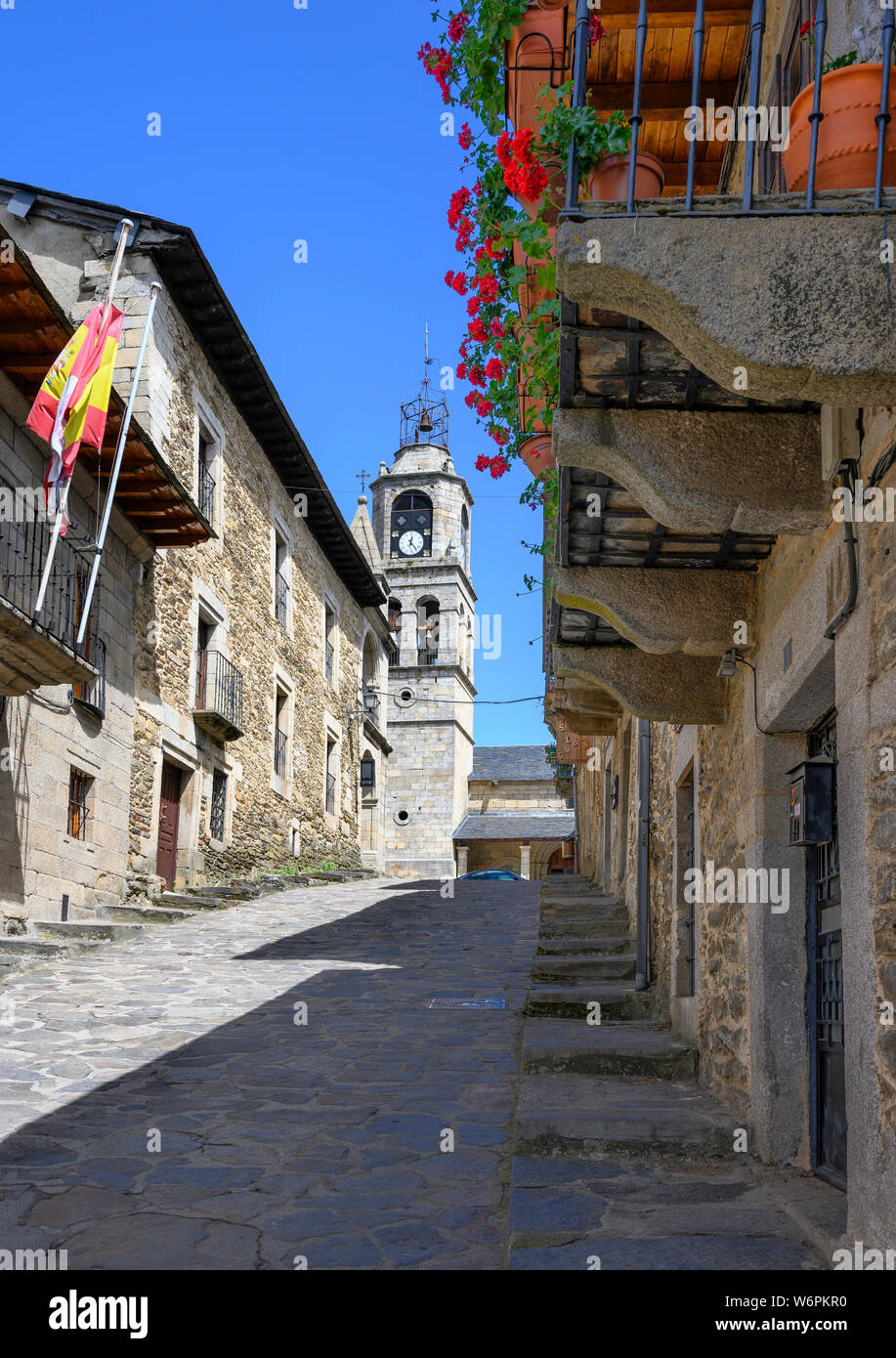 Traditional old houses in the little town of Puebla de Sanabria, with the clock tower of Santa María del Azogue church in the background, North-West Z Stock Photo