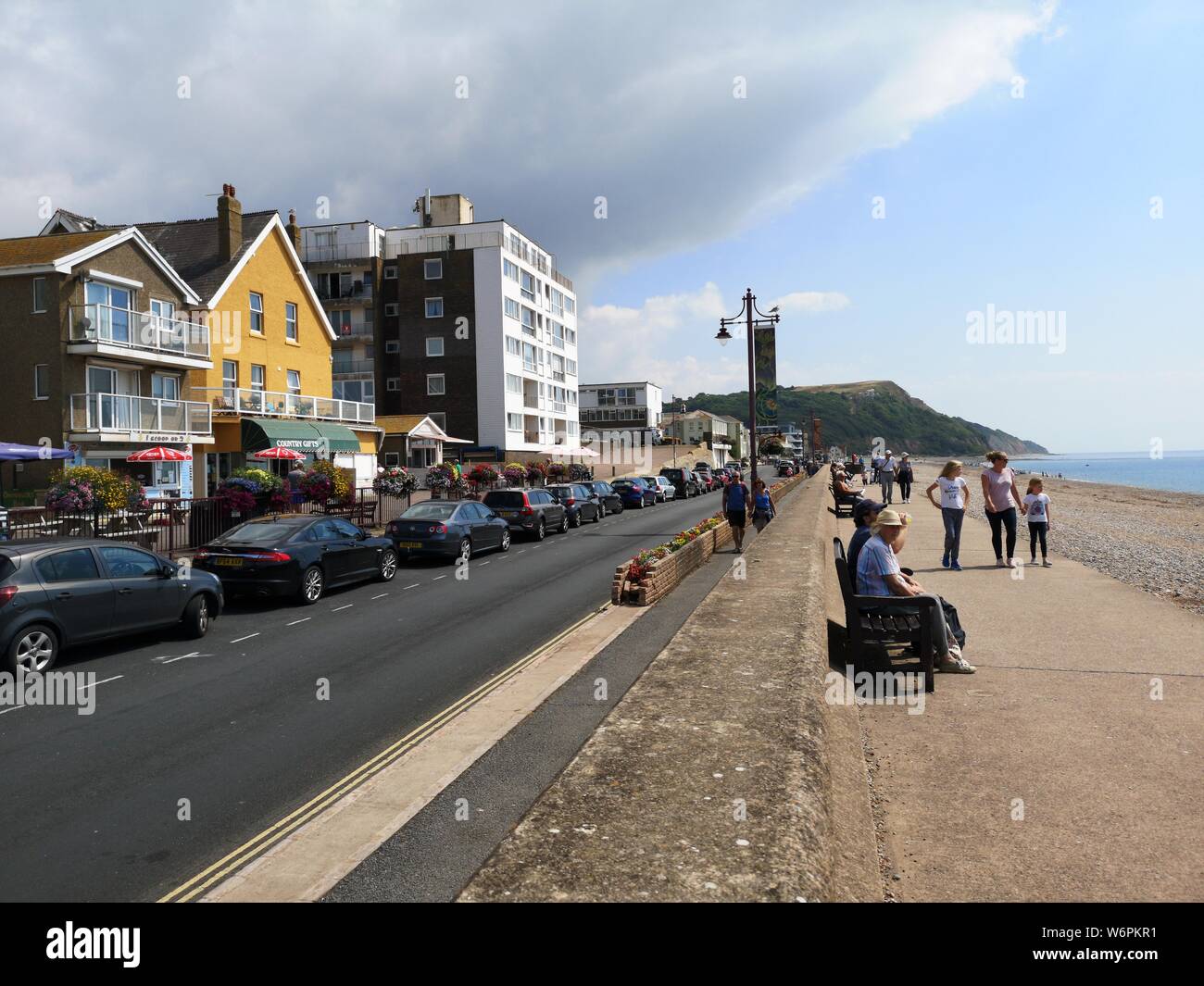 August 2019. Tourists enjoy the sun at Seaton seafront in Devon. Seaton