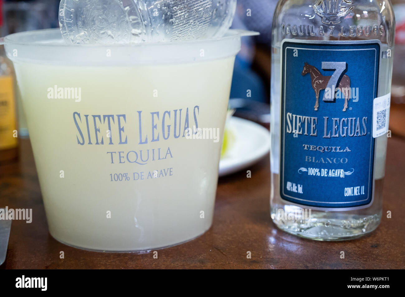 Siete Leguas blanco tequila and margarita mix on the bar for self service at the Fellos Bar in
