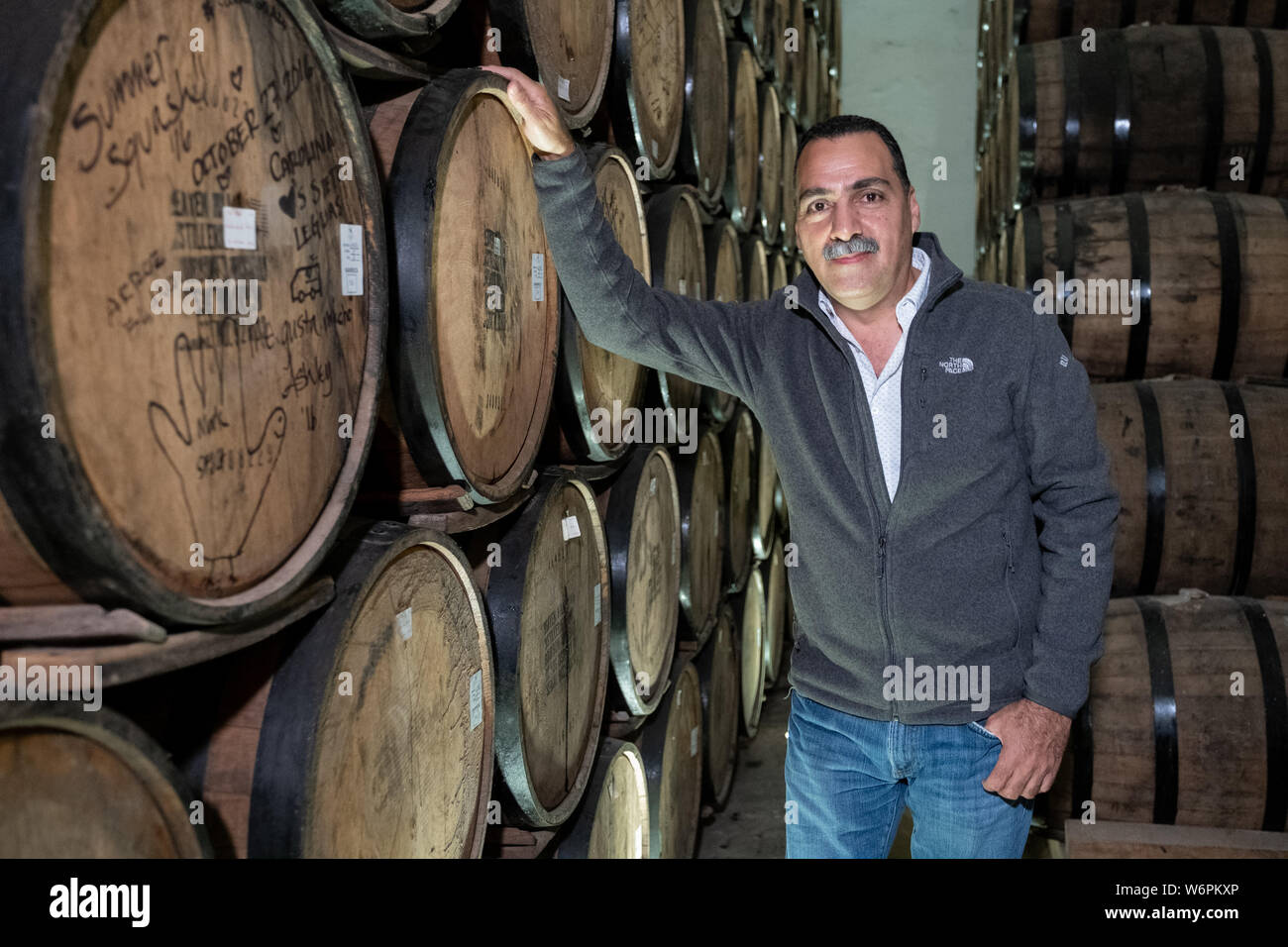 Fernando Gonzales, managing director of Siete Leguas tequila brands and grandson of the founder in the barrel room at the Casa Siete Leguas, El Centenario tequila distillery in Atotonilco de Alto, Jalisco, Mexico. The Seven Leagues tequila distillery is the oldest family owned distillery producing authentic handcrafted tequila using traditional methods. Stock Photo