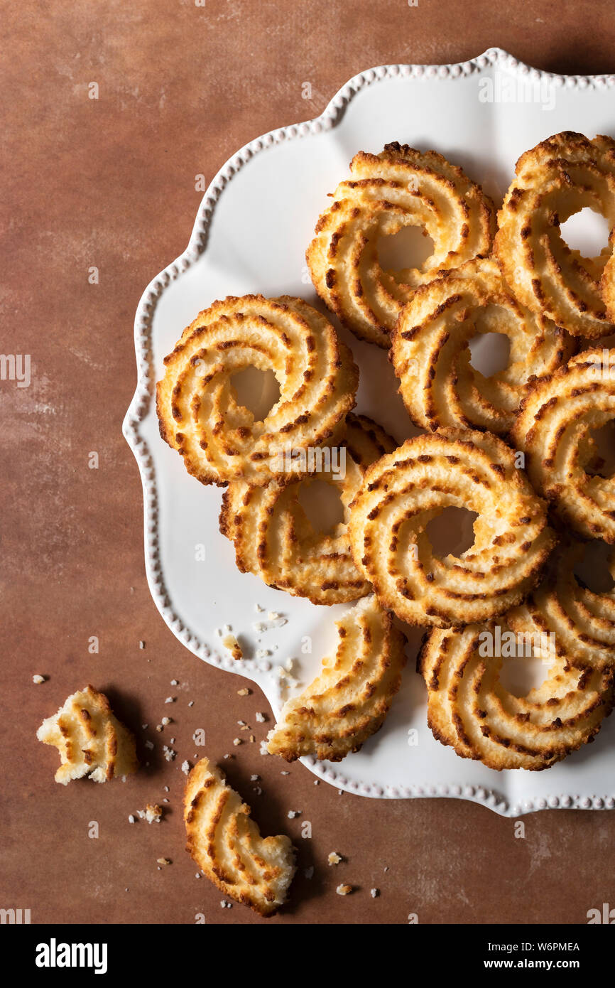 Partial view of coconut biscuits on a plate. Stock Photo