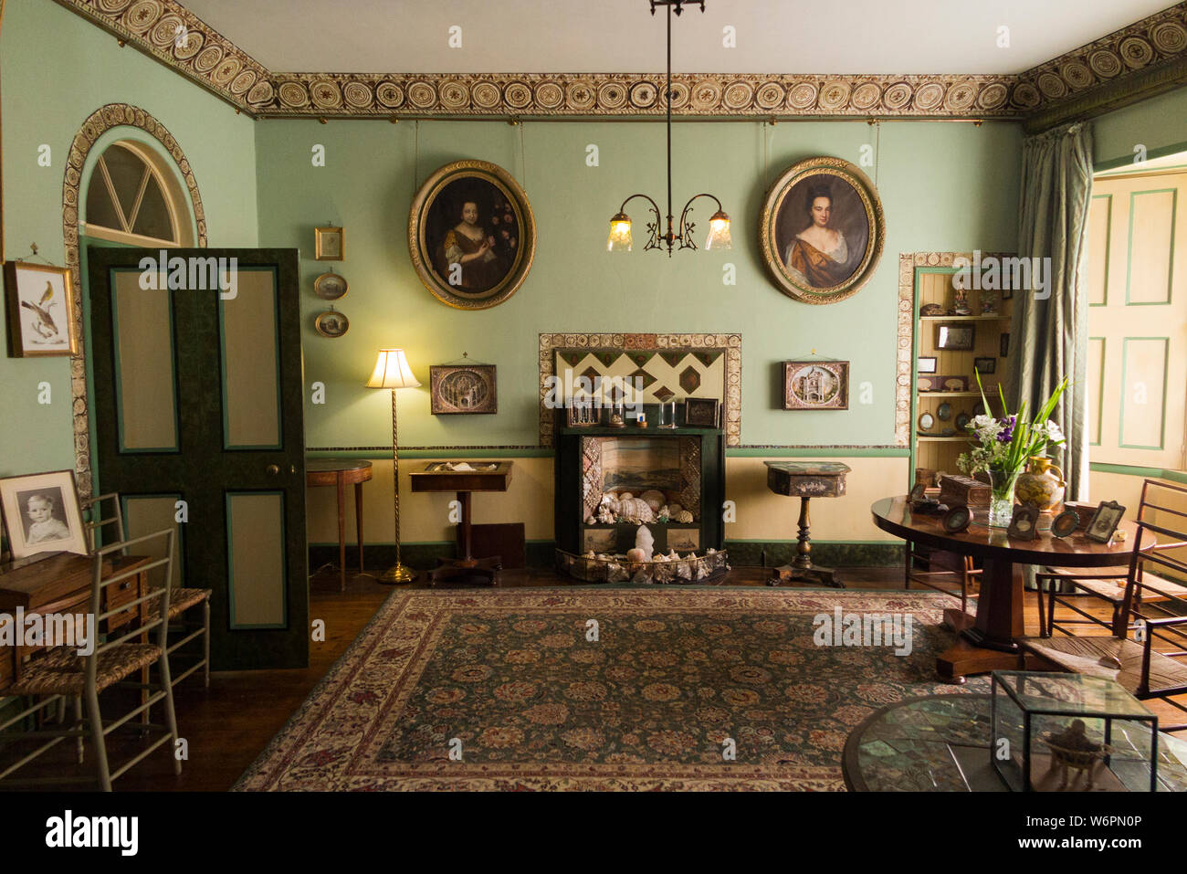 Interior inside the Drawing Room with shell decorated fireplace at A La Ronde – which is an 18th-century 16-sided house located near Lympstone, Exmouth, Devon UK (110) Stock Photo