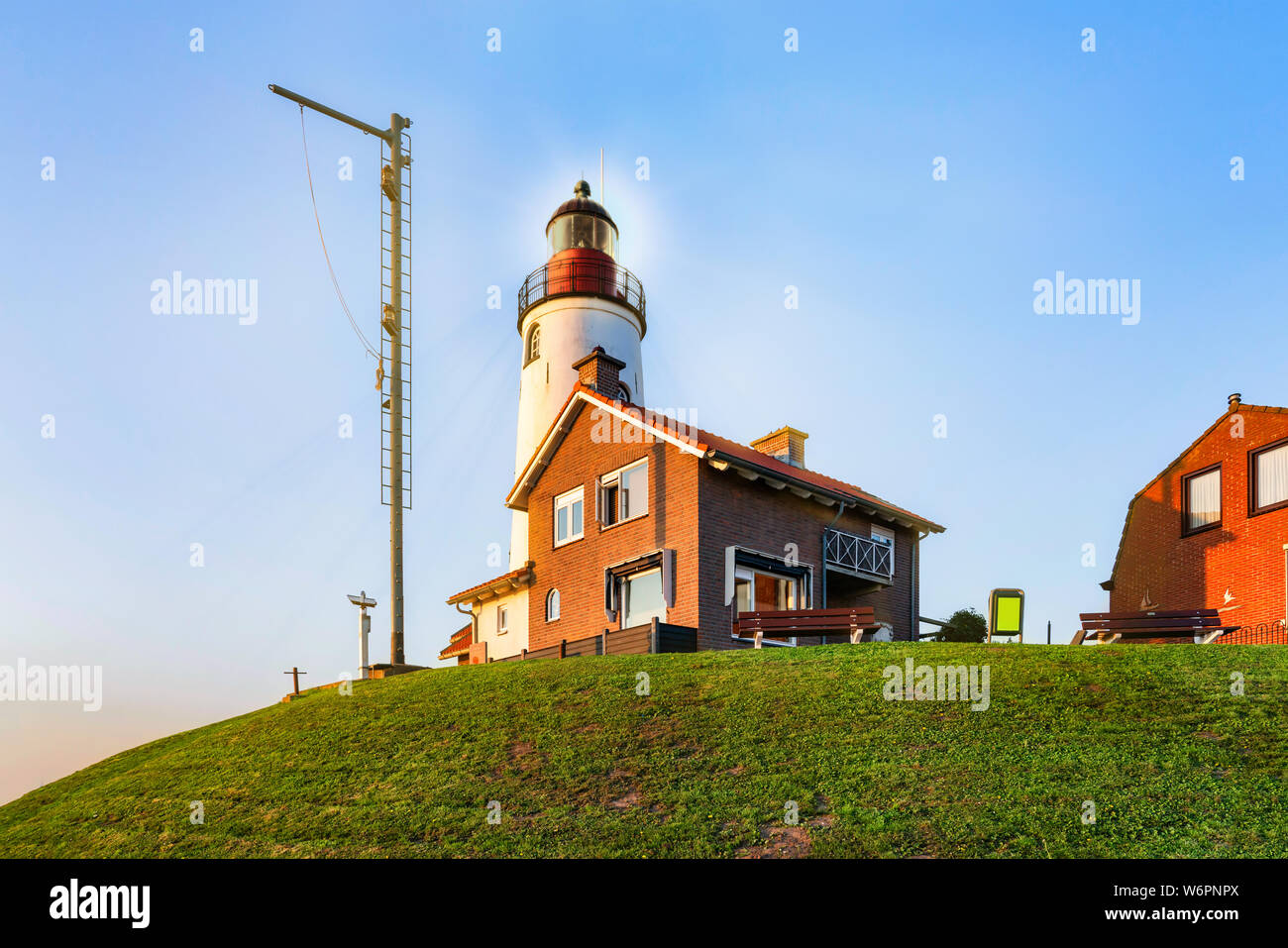 The light house of Urk Netherlands alongside the lake Ijsselmeer on a bright autumn morning Stock Photo