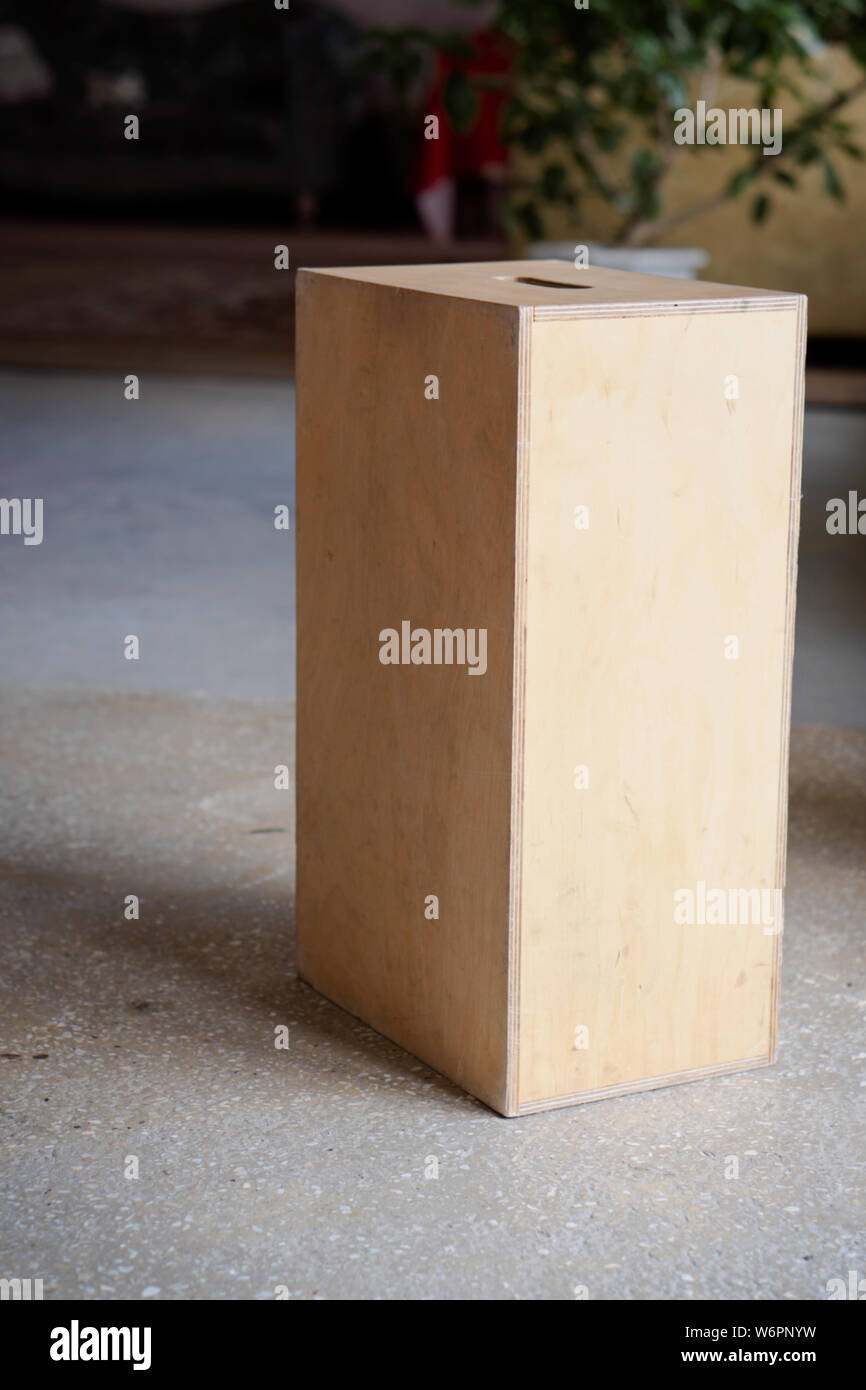 Apple boxes are wooden boxes with holes on each end used chiefly in film production. Stock Photo