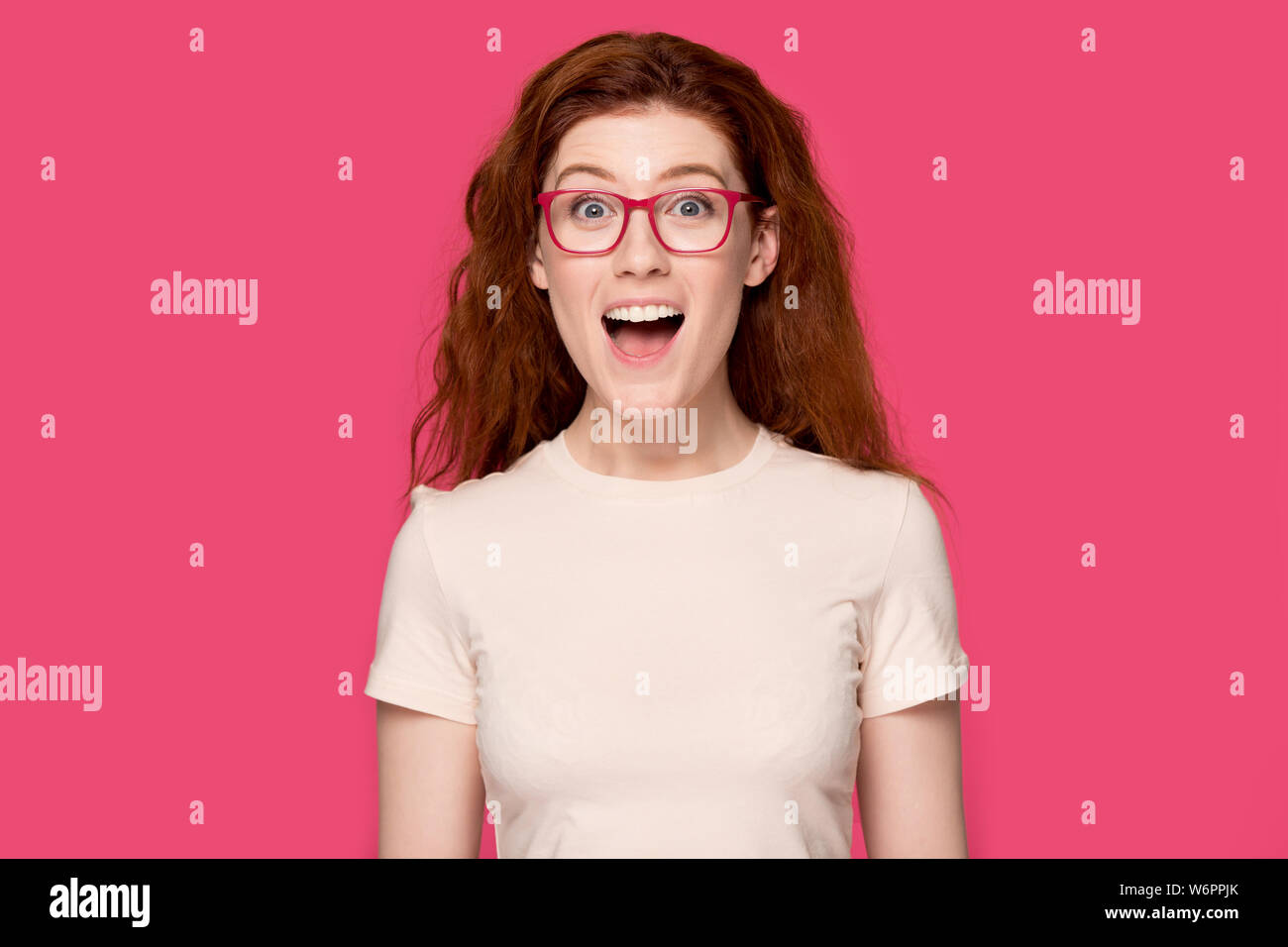 Woman in glasses open mouth feels happy looking at camera Stock Photo