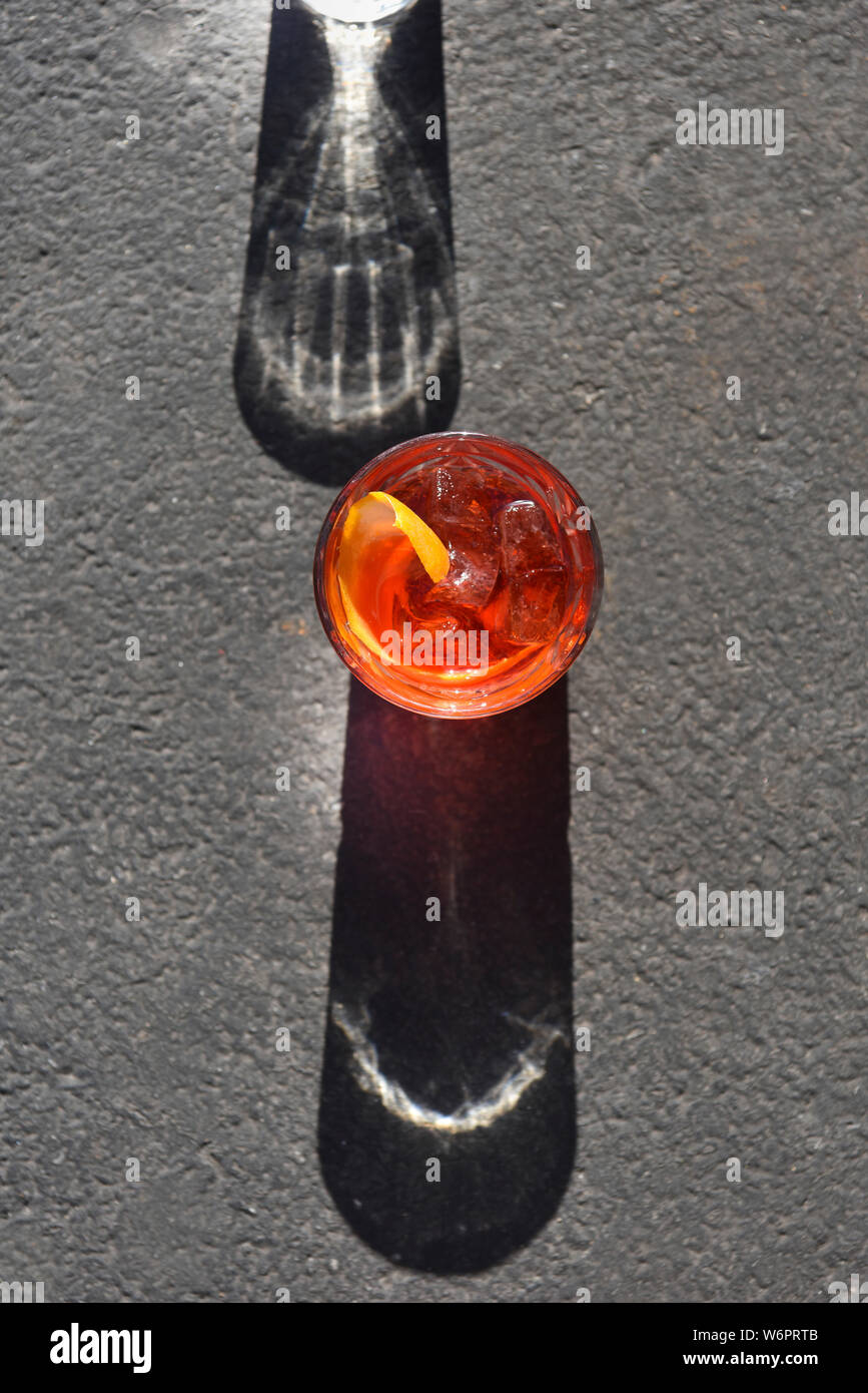 Sunlit Negroni in a glass Stock Photo